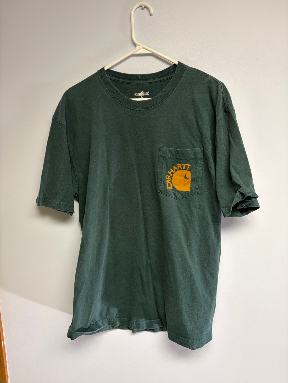 Vintage well- worn Carhartt Men’s Green Pocket T-Shirt with Logo